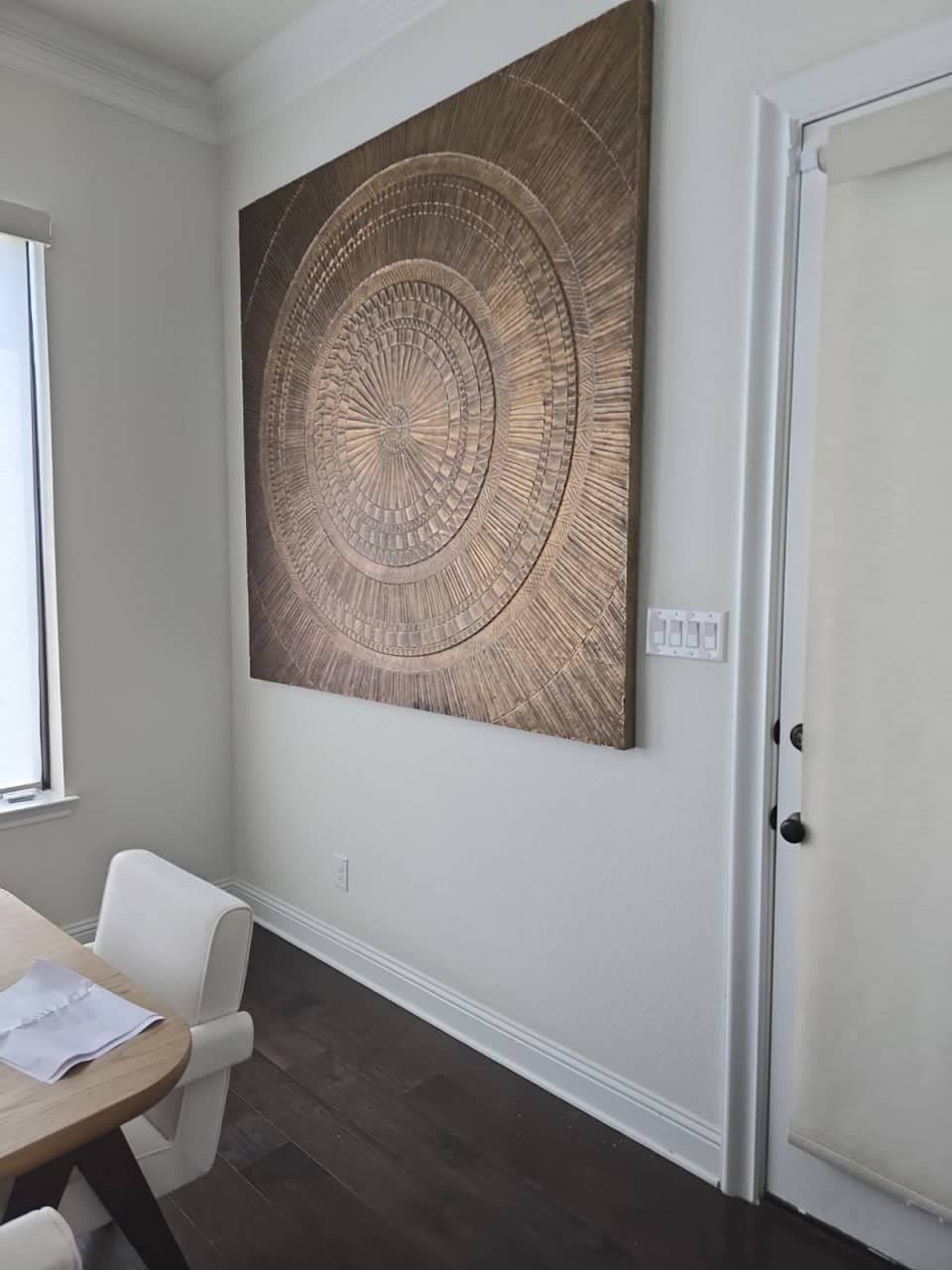 Decorative wall hanging securely installed on a living room accent wall