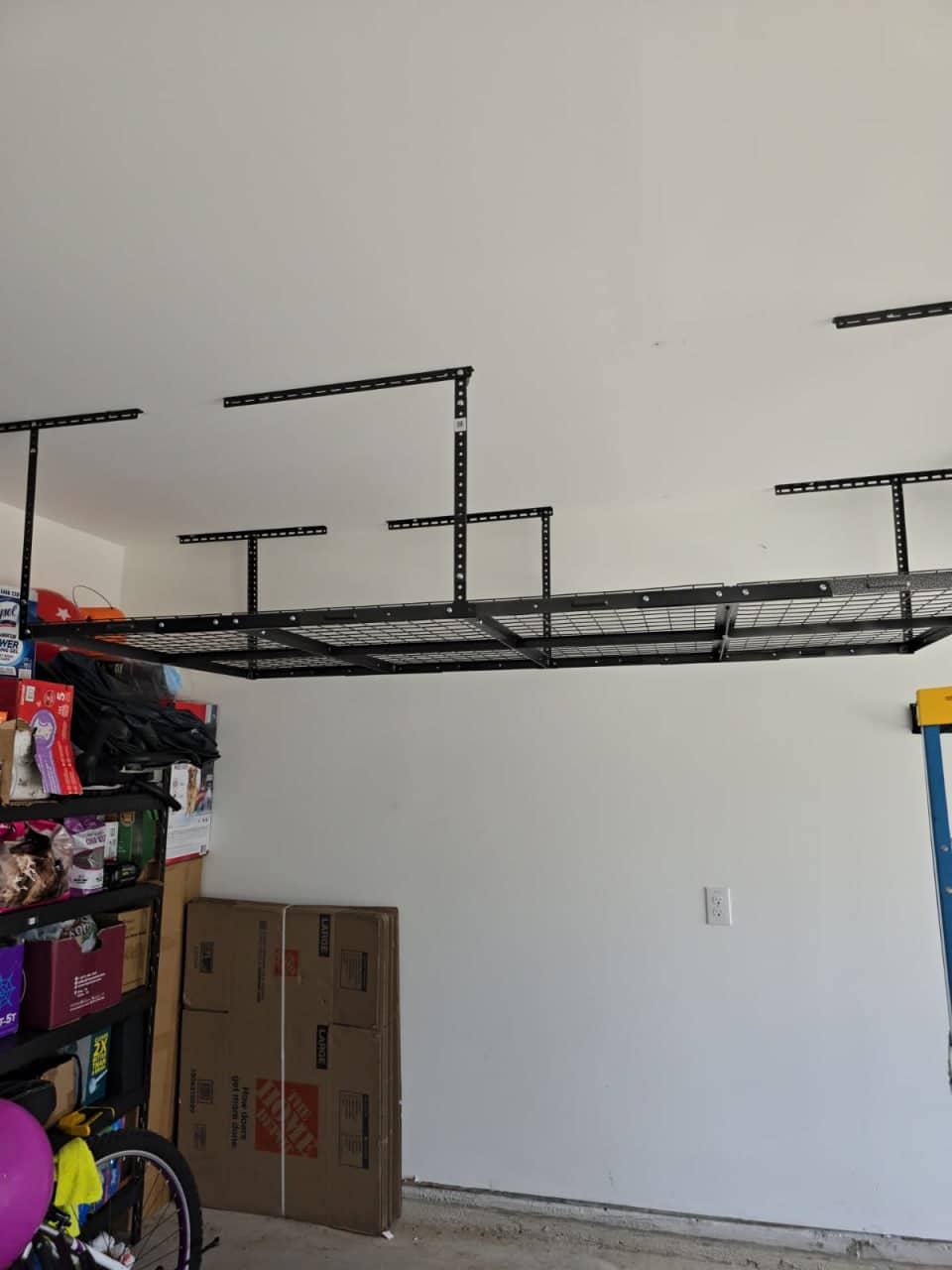 Heavy-duty garage storage shelving rack installed and organized for tool storage