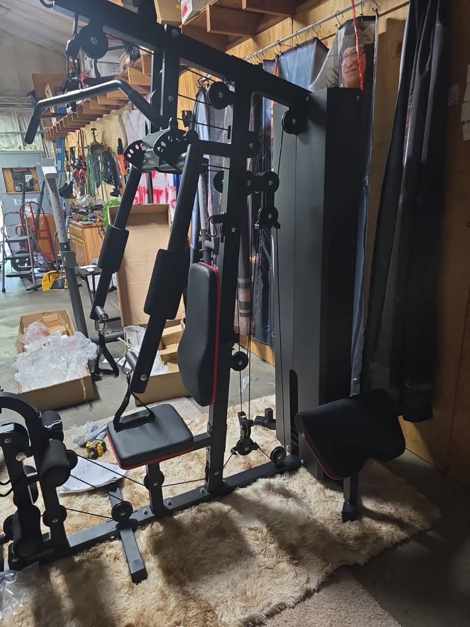 Multi-function home gym machine assembled with cable system and weight stack